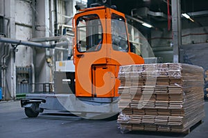 Timber Flooring Factory. Pile of cut wood in factory storage warehouse. Lumber in warehouse