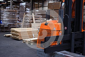 Timber Flooring Factory. Pile of cut wood in factory storage warehouse. Lumber in warehouse