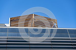 The timber frame of the extension on the roof of the building.