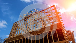 Timber frame house, new build roof with wooden home construction framing