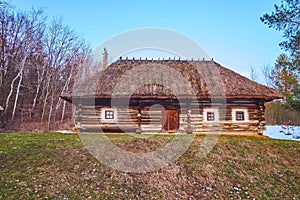 The timber hata house of Bukovyna Region, Pyrohiv Skansen, Kyiv, Ukraine photo