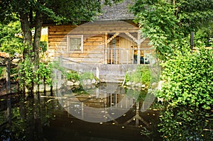 Timber house and garden pond