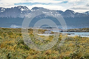 Timber house in Island and mountains view in Beagle Channel - Ushuaia, Tierra del Fuego, Argentina