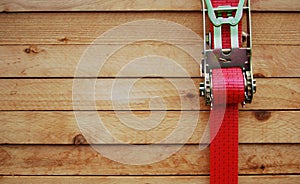 Timber with lashing strap