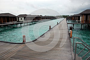 Timber pier and bungalow at Maldives