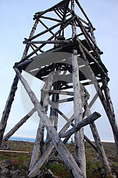 Timber triangulation tower at tundra Russia