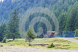 Timber truck on a background of mountains