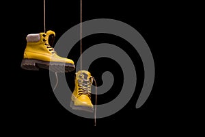 Timberland boots yellow on a black background