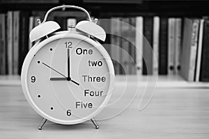 Time 9 nine or 21 twenty-one hours on a desk clock