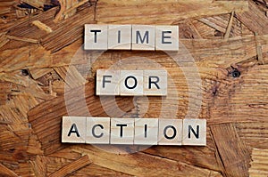 time for action text on wooden square, motivation quotes