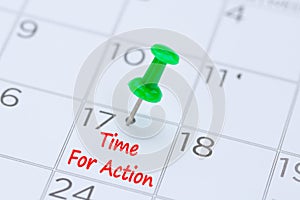 Time For Action written on a calendar with a green push pin to r