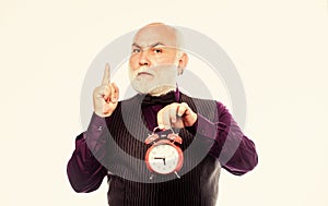 time and age. Timekeeping. mature man with beard clock show time. time management. business startup. retirement