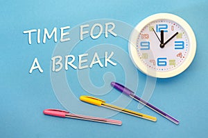 Time for a break - lettering on a blue background and clock