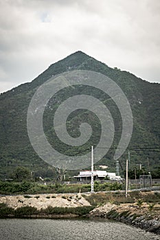 Time change achievement concept, nature power. Dark Beauty vertical landscape scenery, sharp peak forested mountain