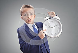 Time on clock shocked and surprised late young executive businessman boy