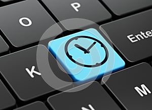 Time concept: Clock on computer keyboard background