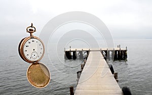 Time concept Vintage clock over lake
