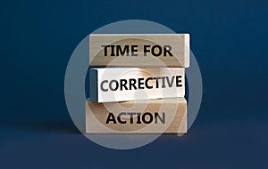 Time for corrective action symbol. Wooden blocks with words `Time for corrective action` on a beautiful grey background. Busines