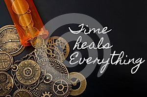 Time cures everything or time heals every pain concept with a bottle of prescription painkiller bottle and small metallic clock