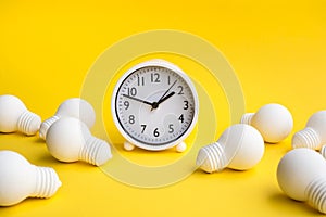 Time,dateline and creativity concepts with group of lightbulb and clock on pastel color background.Business solution.Performance