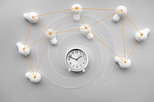 Time,dateline and teamwork concepts with group of lightbulb and alarm clock on white color background