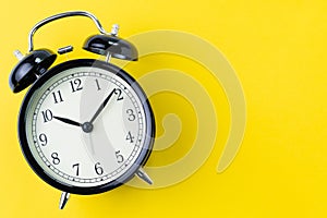 Time, deadline or reminder concept, vintage ringing black alarm