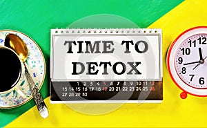 Time for detoxification the text of the plan is written on the calendar. The clock reminds you of future events. A Cup of tea for
