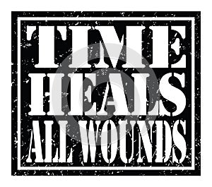 TIME HEALS ALL WOUNDS, text written on black stamp sign