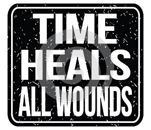 TIME HEALS ALL WOUNDS, words on black stamp sign