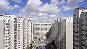 Time laps clouds on multi-storey buildings.