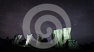 Time laps of star and milky way movement at night of cloudy sky above on Stonehenge