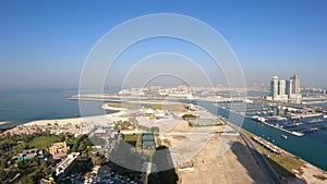 Time lapse aerial view of Skydive Dubai Palm Drop zone at JBR Beach with the runway environment