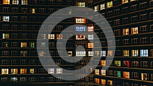 Time lapse of apartment building at night. Timelapse of residential flats windows lighting up and turning off overnight