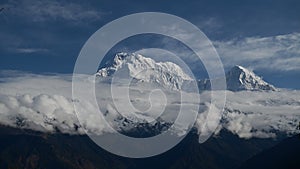 Time lapse of Beautiful Mountain View of Annapurna shown after being obscured by clouds during the day, Pokhara, Nepal, Asia