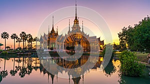 Time lapse of Buddhist temple with reflection on water landmark of Nakhon Ratchasima Province, Thailand