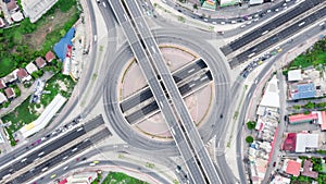 Time-lapse of car traffic transportation above roundabout road. Drone aerial top view. Public transport or commuter city life