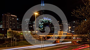 Time lapse of Chicago West Loop traffic cityscape at night. Street in Illinois.