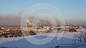Time lapse cityscape with smoking pipes of metallurgical plant winter.