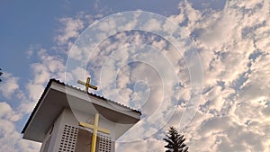 Time lapse closeup moving clouds behind christian church in Thailand