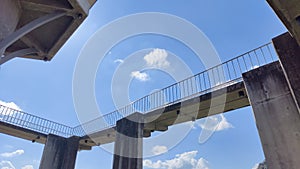 time lapse of clouds with empty footbridge in Thailand