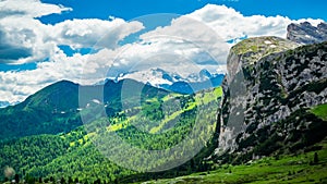 Time lapse of clouds moving in the blue sky over the limestone of Italian Alps the Dolomites