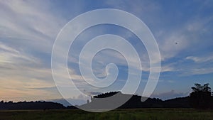 time lapse clouds moving from left to right on rice field in Thailand