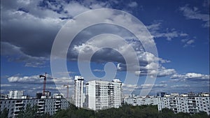 Time-lapse of clouds over the city and the building in the spring.