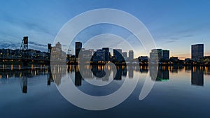 Time lapse of clouds over city of Portland Or with water reflection 4k uhd