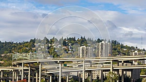 Time lapse of clouds over freeway traffic on Marquam bridge with homes on hillside in Portland OR 4k