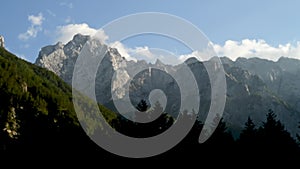 Time lapse clouds over mountain peak