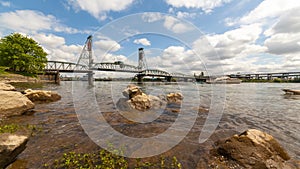 Time lapse of clouds over Willamette River with Hawthorne Bridge in Portland Or