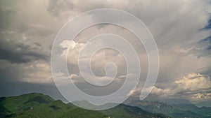 Time lapse of clouds and snow clad mountains while blue sky in the background