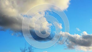 Time lapse of cloudscape with bright sun shining with clouds passing.