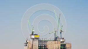 Time lapse of construction site with heavy duty industrial crane busy operate